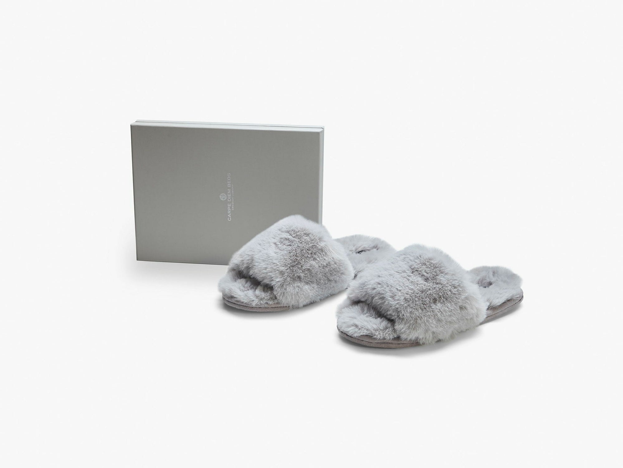 Tofflor i fuskpäls – 50% rabatt